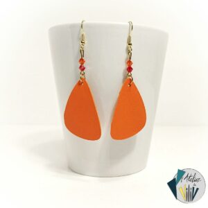 boucles asymétriques en cuir orange